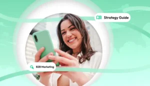 Woman smiling while using her phone with labels indicating this is a strategy guide focused on B2B marketing.